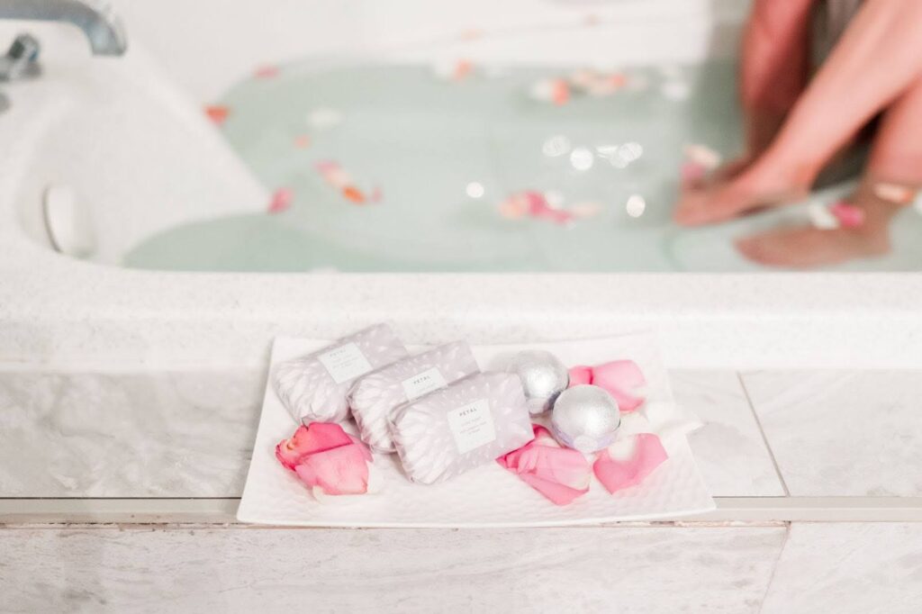Couple relaxing side-by-side during a massage in a serene, softly lit treatment room at a luxury coastal spa in Myrtle Beach, with calming décor and a tranquil atmosphere.